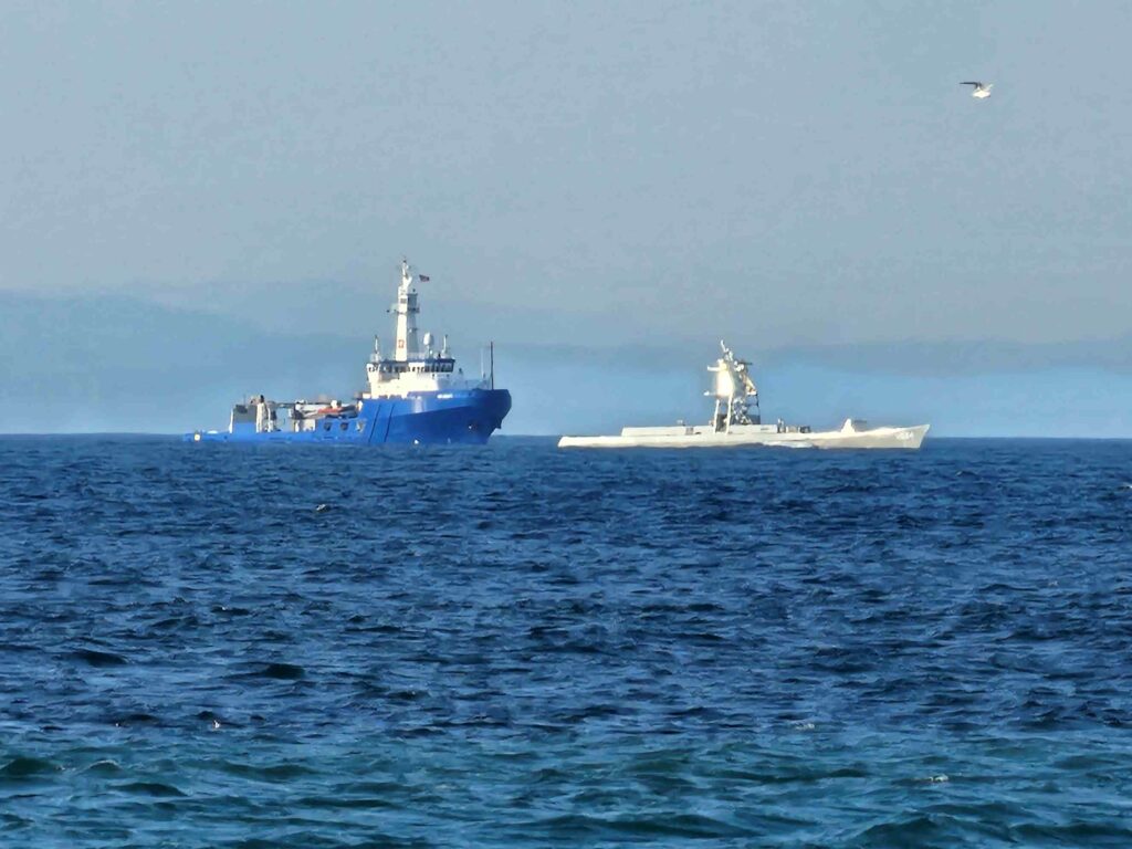 USX-1 Defiant and escort Melissa C in Strait of Juan de Fuca