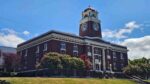 Old red brick and white stone Clallam County Courthouse with bell tower